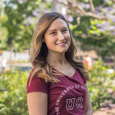 Woman in maroon UQ T-shirt